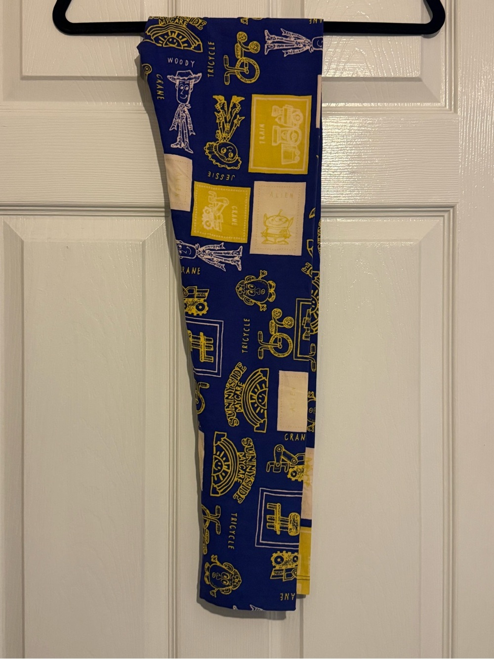 LuLaRoe One Size Royal Blue and Yellow Toy Print Leggings
